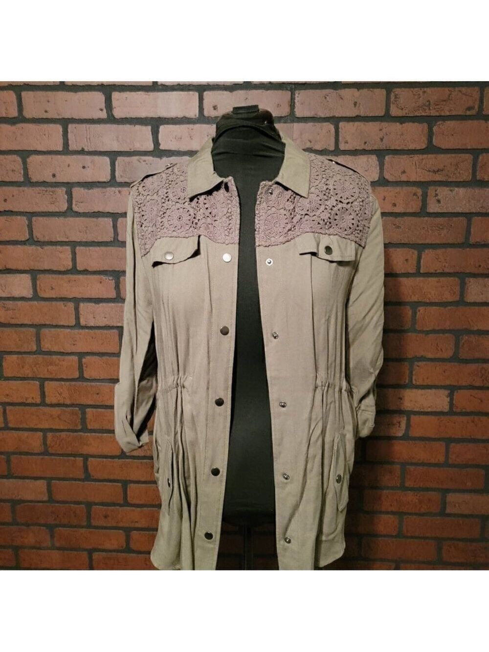 Versona Army Green snap front jacket with crochet lace detail, drawstring waist